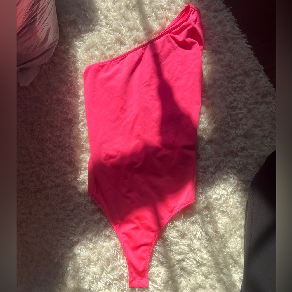 Pink body suit